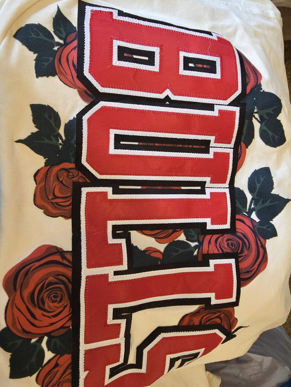 NBA Women's White Top with Red Lettering and Rose Graphic . MAN OR WOMAN